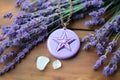 ceramic pentacle pendant resting on fresh lavender flowers