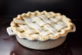 ceramic pie dish with lattice pastry top ready to bake Royalty Free Stock Photo