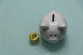 Ceramic Piggy bank with pile of crypto currrency coins Royalty Free Stock Photo