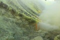 Ceramic pipes used for sulfur mining inside the crater of Kawah Ijen volcano, East Java, Indonesia