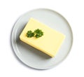 Ceramic plate with block of fresh butter on white background Royalty Free Stock Photo