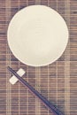 Ceramic plate and wood chopsticks Royalty Free Stock Photo