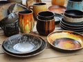 ceramic plates and bowls colored in yellow-brown and grey-white