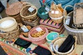 Ceramic plates, hand-painted wooden souvenirs are on the counter at the festive fair.