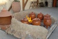 Ceramic pots with food on a fire