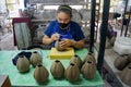 A ceramic potter is carving a pattern on the ceramic gelatin.