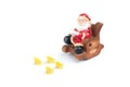 Ceramic santa claus in a chair reading a book in front of