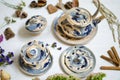 Ceramic set of cups and dishes. Decorative pottery on the white