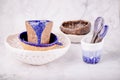 Ceramic set on a white marble background. White, blue and brown colors. Cups, spoons, bowls. Handmade Royalty Free Stock Photo