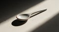 A ceramic spoon rests on a Royalty Free Stock Photo