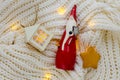 A ceramic statue of Santa Claus on a knitted scarf Royalty Free Stock Photo