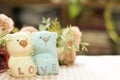 Ceramic Statues Little bear lovers with flower decoration blur background. Valentine Concept.Vintage and Insragram style