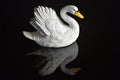 Ceramic swan on black glass background Royalty Free Stock Photo