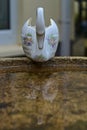Ceramic swan reflected in water Royalty Free Stock Photo