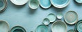 Ceramic tableware in blue and green tones displayed on a textured blue background Royalty Free Stock Photo