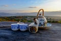 Ceramic tea cup on wooden table in morning