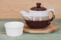 Ceramic tea pot with small cups Royalty Free Stock Photo