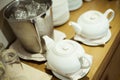 Ceramic teapot are placed on wooden boards
