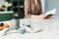 Ceramic teapot with two cups on tablecloth Royalty Free Stock Photo