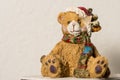 A ceramic teddy bear figure at christmas time
