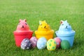 Ceramic three rabbit with eggs on grass on Easter day Royalty Free Stock Photo