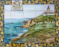 Ceramic tile in Lisbon street with image of Cabo da Roca Lighthouse, Portugal. Most western point of Europe mainland. Royalty Free Stock Photo