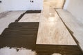 Ceramic tiles. Floor tiles installation. Home improvement, renovation - ceramic tile floor adhesive, mortar Royalty Free Stock Photo