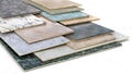 Ceramic tiles samples in different sizes and colour spectrum stacked one on another. Royalty Free Stock Photo
