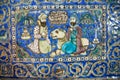 Ceramic tiles of 19th century with a lion & two persian men talking in garden