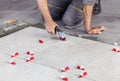 Ceramic Tiles. Tiler placing ceramic wall tile in position over Royalty Free Stock Photo