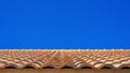 Ceramic top roof / ceramic tile roof in wave shape overlay stack with clear blue sky