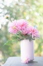 ceramic vase with beautiful pink dahlias on the terrace, garden decor Royalty Free Stock Photo