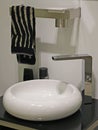 Ceramic washbasin and bathroom accessories.