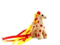 Ceramic whistle horse with a mane of yellow and red ribbons and painted with flowers isolated on a white background Royalty Free Stock Photo