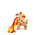 Ceramic whistle horse with a mane of yellow and red ribbons and painted with flowers isolated on a white background Royalty Free Stock Photo