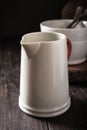 Ceramic white jug with red handle Royalty Free Stock Photo