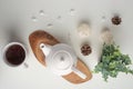 Ceramic white teapot with accessories on a white table, horizontal frame, tea time, tea drinking, retual tea making Royalty Free Stock Photo