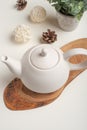 Ceramic white teapot with accessories on a white table, horizontal frame, tea time, tea drinking, retual tea making Royalty Free Stock Photo