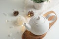 Ceramic white teapot with accessories on a white table, horizontal frame, tea time, tea drinking, retual tea making Royalty Free Stock Photo
