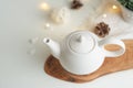Ceramic white teapot with accessories on a white table, horizontal frame, tea time, tea drinking, retual tea making Royalty Free Stock Photo