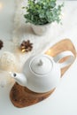 Ceramic white teapot with accessories on a white table, horizontal frame, tea time, tea drinking, retual tea making Royalty Free Stock Photo