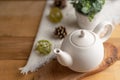 Ceramic white teapot with accessories on a wooden table, horizontal frame, tea time, tea drinking, retual tea making Royalty Free Stock Photo