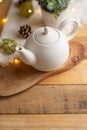 Ceramic white teapot with accessories on a wooden table, vertical frame, tea time, tea drinking, retual tea making Royalty Free Stock Photo