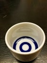 Ceramics glass of sake on wood table. Royalty Free Stock Photo