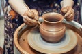 Ceramics. The master at the potter`s wheel produces a vessel of clay, decorating.