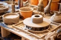 ceramics wheel with clay and pottery tools