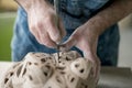 Ceramist Dressed in an Apron Sculpting Statue from Raw Clay in Bright Ceramic Workshop. Royalty Free Stock Photo