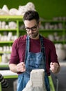 Ceramist Dressed in an Apron Working with Raw Clay in Bright Ceramic Workshop. Royalty Free Stock Photo