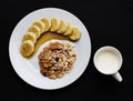 Cereal with banana topped with honey and milk one cup to health Royalty Free Stock Photo