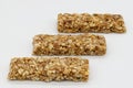 Cereal bar with apricot, apple and dried fruit on white background Royalty Free Stock Photo